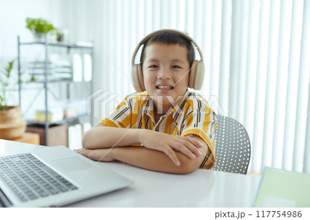 Portrait of Asian Child Listening to Music with Headphones Portrait of Asian Child Listening to Music with Headphones 117754986