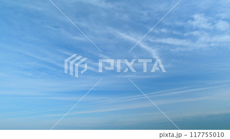 Cloud nature background. Blue sky with clouds and sun. Nature background of airy cloudscape. Timelapse. Cloud nature background. Blue sky with clouds and sun. Nature background of airy cloudscape. Timelapse. 117755010