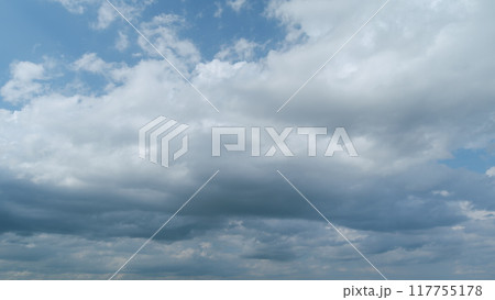 Sky before storm. Stormy cloudy sky wide panorama. Storm cloudy dramatic sky with dark rain grey cumulus cloud and blue sky. Timelapse. Sky before storm. Stormy cloudy sky wide panorama. Storm cloudy dramatic sky with dark rain grey cumulus cloud and blue sky. Timelapse. 117755178