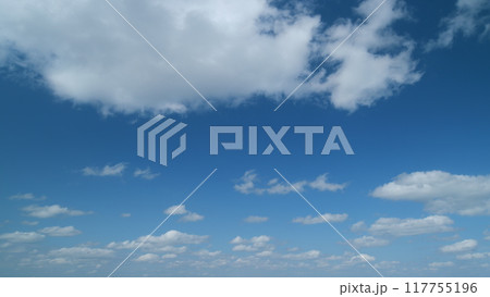Sky after the storm. Majestic amazing blue sky with stratocumulus clouds. Nature cumulus clouds moving. Timelapse. 117755196