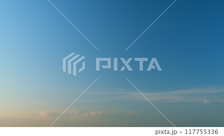 Clouds move in the blue sky. Tropical sky at day time, only white and blue colors. Semi-transparent layers on different height. Timelapse. Clouds move in the blue sky. Tropical sky at day time, only white and blue colors. Semi-transparent layers on different height. Timelapse. 117755336