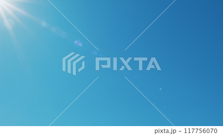 Sun Shining Bright In Clear Blue Sky. Solar Energy Power Concept Of Natural Bright Sun Light Ray. Tropical Summer Sunlight. Atmosphere And Ozone Layer. Sun Shining Bright In Clear Blue Sky. Solar Energy Power Concept Of Natural Bright Sun Light Ray. Tropical Summer Sunlight. Atmosphere And Ozone Layer. 117756070