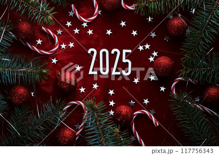 New Year red 2025 background. Number of the coming year in Christmas decoration. 117756343