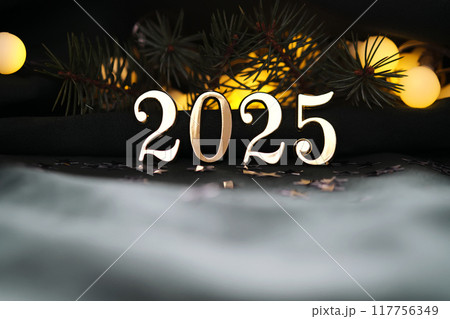 New Year's holiday background with bokeh with the number of the year 2025. 117756349