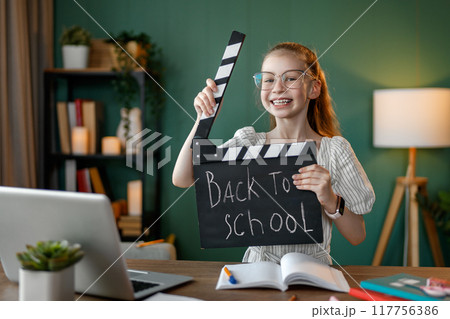 Girl doing homework Girl doing homework 117756386