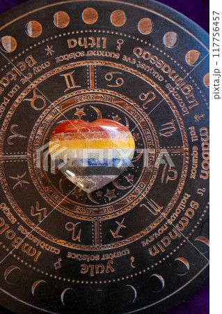 Healing crystals on brown background 117756457