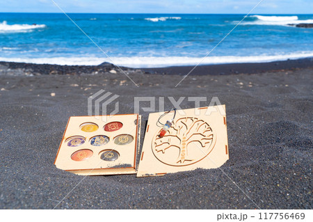 Healing crystals on black sand background 117756469