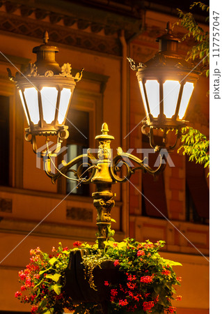 Vintage street iron lamp in the center of Novi sad in Serbia at night Vintage street iron lamp in the center of Novi sad in Serbia at night 117757047