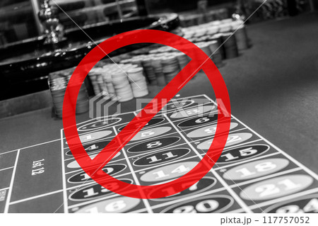 Roulette table with prohibition sign. The prohibition of gambling. Ban gambling. Stop gambling sign Roulette table with prohibition sign. The prohibition of gambling. Ban gambling. Stop gambling sign 117757052