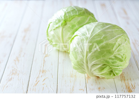 fresh cabbage on a light wooden table, selective focus. 117757132