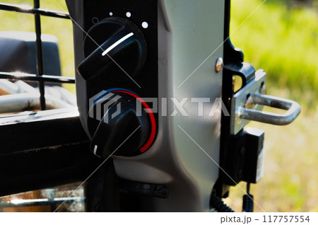 Controls of a small excavator in the cab. Background for special equipment theme concept Controls of a small excavator in the cab. Background for special equipment theme concept 117757554