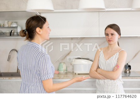 Quarrel between an mother and an adult daughter in kitchen 117764620