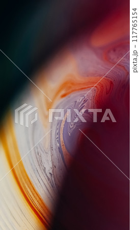 Paint curve. Blur ink mix. Defocused blue yellow color acrylic liquid emulsion blend stain wave on dark abstract art background. 117765154