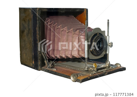 Old wooden photo camera and lens isolated Old wooden photo camera and lens isolated 117771384