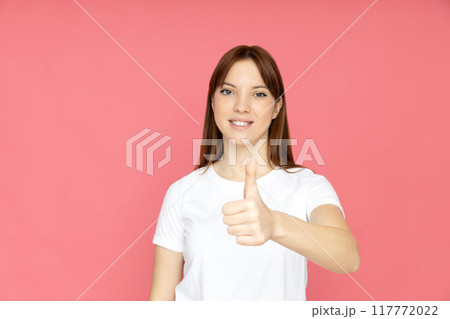 An attractive young girl on a plain background 117772022