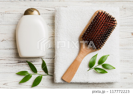 cosmetic for hair care, cream and towel on a colored background top view. flat lay 117772223