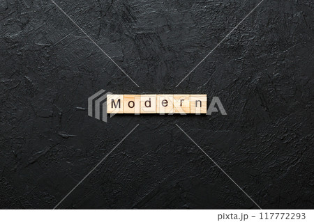 modern word written on wood block. modern text on cement table for your desing, concept modern word written on wood block. modern text on cement table for your desing, concept 117772293