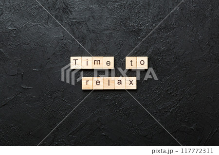time to relax word written on wood block. time to relax text on table, concept 117772311