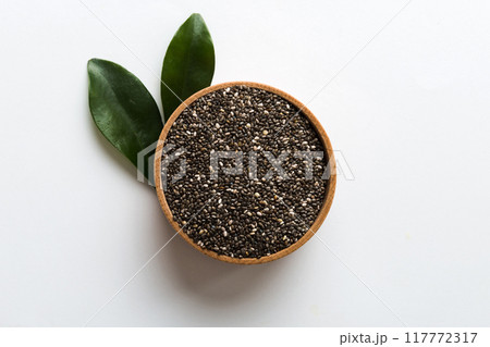 Chia seeds in bowl on colored background. Healthy Salvia hispanica in small bowl. Healthy superfood 117772317