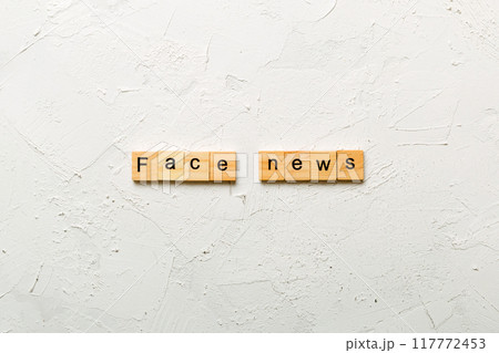 fake news word written on wood block. fake news text on table, concept 117772453