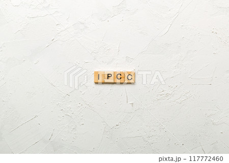 IPCC word written on wood block. abbreviation Intergovernmental Panel on Climate Change text on cement table for your desing, concept 117772460