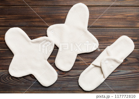 Eco-friendly reusable fabric women's pads. set of colorful bright reusable menstrual pads. zero waste woman periods concept top view with copy space 117772810