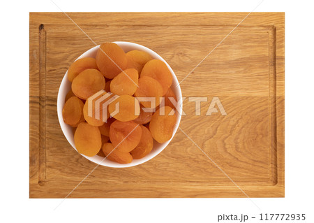 dried apricots in bowl isolated on white dried apricots in bowl isolated on white 117772935
