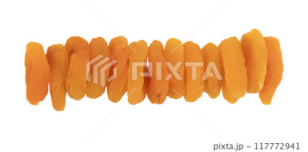 heap of dried apricots isolated on white background heap of dried apricots isolated on white background 117772941