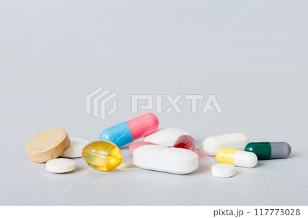 Many different colorful medication and pills perspective view. Set of many pills on colored background Many different colorful medication and pills perspective view. Set of many pills on colored background 117773028