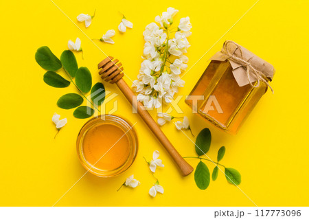 honey jar with acacia flowers and leaves. fresh honey top view flat lay 117773096