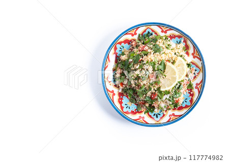 Tabbouleh salad with couscous and vegetables isolated on white background Tabbouleh salad with couscous and vegetables isolated on white background 117774982