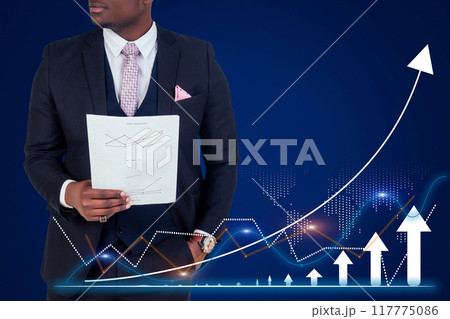 A man in a suit holding a piece of paper with a graph on it A man in a suit holding a piece of paper with a graph on it 117775086