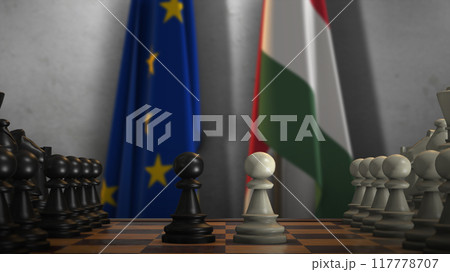 Hungary And EU Flags. Politics And Conflict Concept 3D Illustration. Chess Board Game Play Hungary And EU Flags. Politics And Conflict Concept 3D Illustration. Chess Board Game Play 117778707