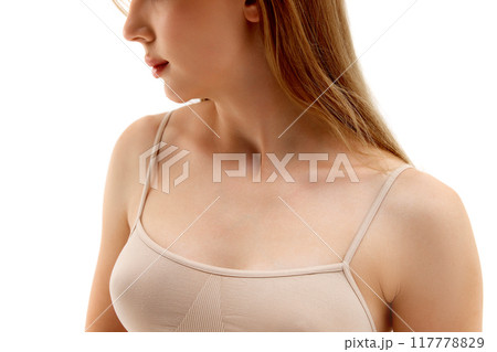 Cropped Image of female body, breast. model posing in underwear, isolated on white background. Health awareness, plastic surgery 117778829
