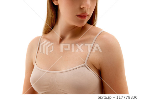 Cropped Image of female body, breast. model posing in underwear, isolated on white background. Health awareness, plastic surgery 117778830