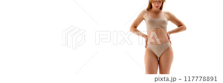 Cropped image of young woman posing in underwear isolated on white background. Fit sportive body shape Cropped image of young woman posing in underwear isolated on white background. Fit sportive body shape 117778891