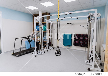 Fitness gym with professional equipment for workouts and physical therapy - perfect for training Fitness gym with professional equipment for workouts and physical therapy - perfect for training 117780902