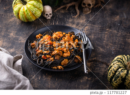 Halloween dish black pasta with bolognese 117781227