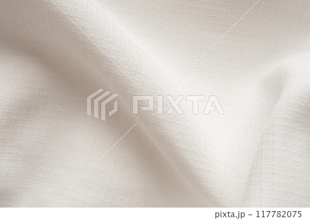White sports clothing fabric football shirt jersey texture abstract background White sports clothing fabric football shirt jersey texture abstract background 117782075