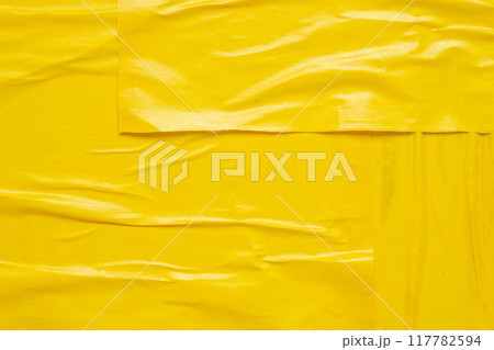 Blank yellow crumpled and creased paper poster texture background Blank yellow crumpled and creased paper poster texture background 117782594