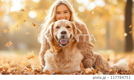 The dog plays in the autumn park in sunny day. Beautiful young woman playing with a dog. AI-generated item  117784751