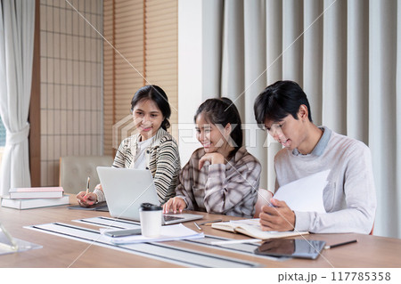 Happy Students Engaged in Study Group Indoors Happy Students Engaged in Study Group Indoors 117785358