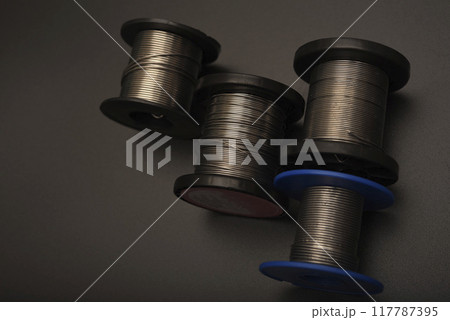 Lead solder. Coils of lead solder. Soldering of electronic equipment. Lead solder. Coils of lead solder. Soldering of electronic equipment. 117787395