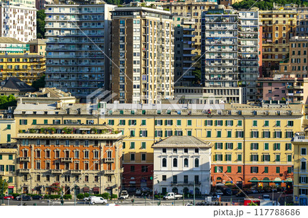 Genoa city skyline in afternoon sunlight, high-rise apartment buildings on the hillside Genoa city skyline in afternoon sunlight, high-rise apartment buildings on the hillside 117788686