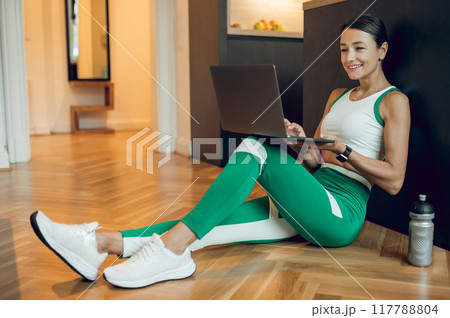 Woman fitness instructor teaching online class working making video blog about sport workout Woman fitness instructor teaching online class working making video blog about sport workout 117788804