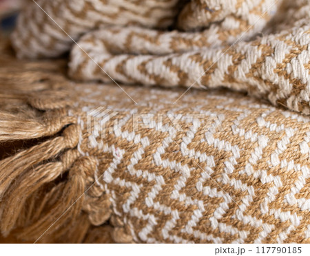 Rustic cotton zig zag woven blanket with beige bangs. Rustic cotton zig zag woven blanket with beige bangs. 117790185