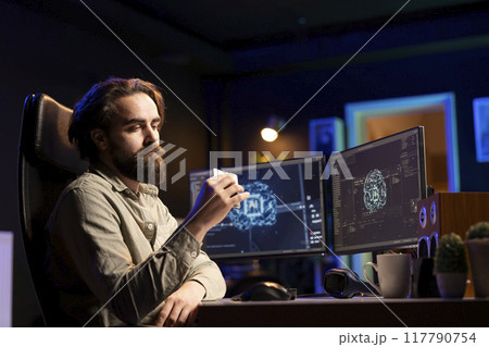 Hacker uploading evolved sentient AI to disk, planning to use it for evil mastermind plan. Rogue programmer putting malware infected artificial intelligence bot in cartridge Hacker uploading evolved sentient AI to disk, planning to use it for evil mastermind plan. Rogue programmer putting malware infected artificial intelligence bot in cartridge 117790754