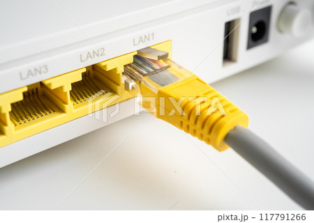 Ethernet cable with wireless router connect to internet service provider internet network. 117791266