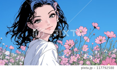 コスモス畑にいる若い女性