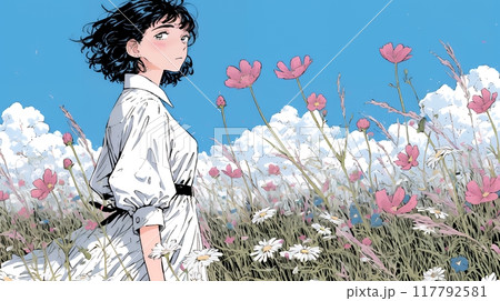 コスモス畑にいる若い女性